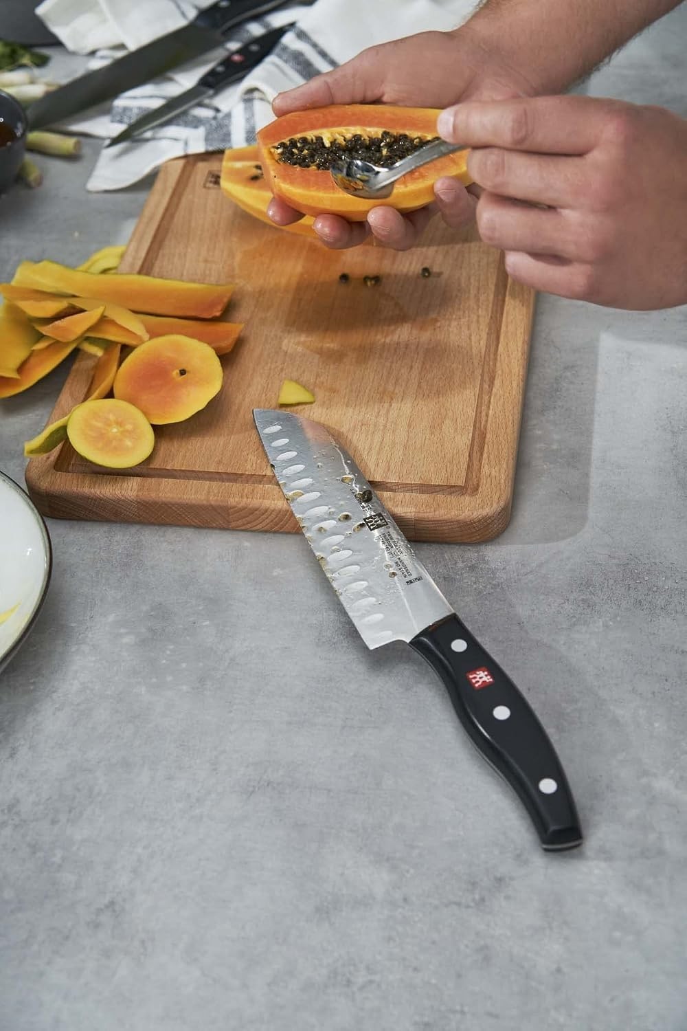 Twin Signature 7-inch Razor-Sharp German Hollow Edge Santoku Knife, Made in C…