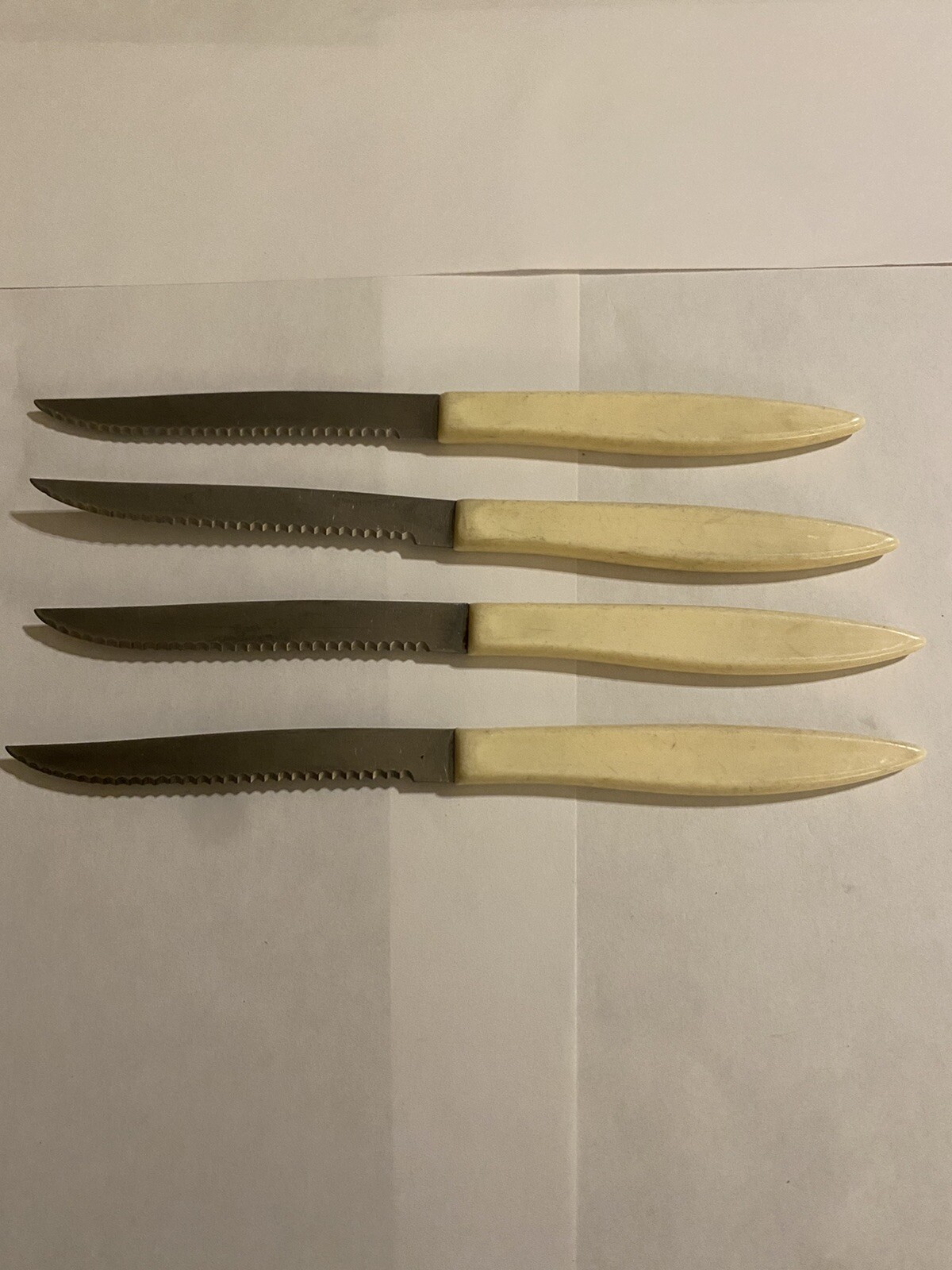 Vintage Quikut Cream Color Handle Steak Knife Set of 4. 4” Blade