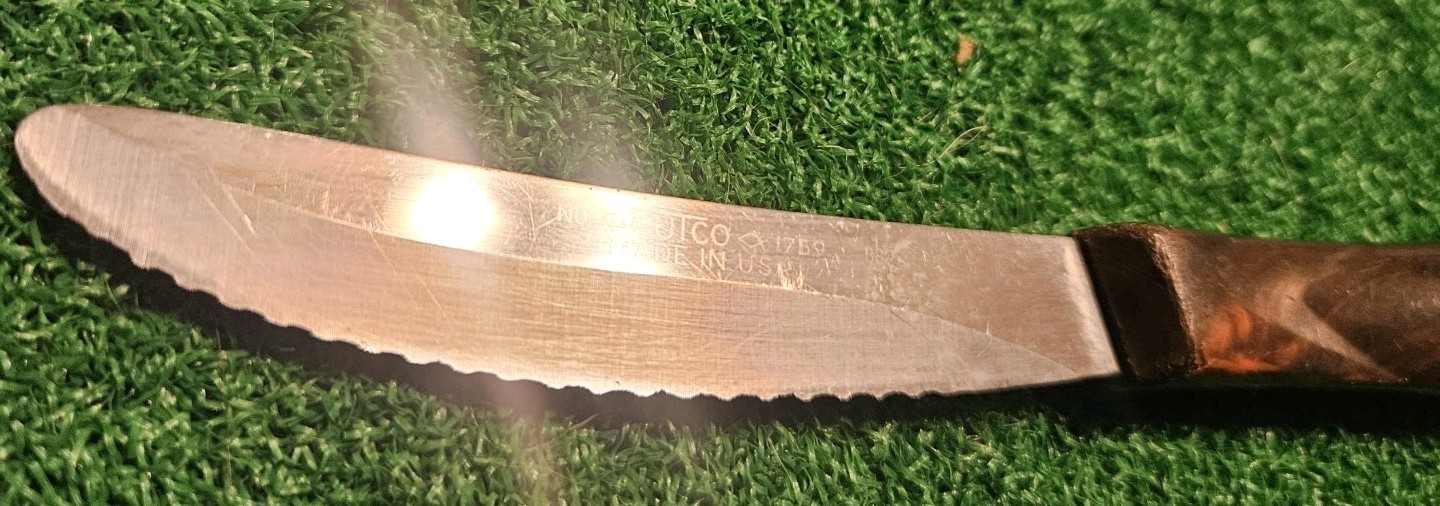 Cutco 1759 Serrated Table Knive Classic Brown Swirl Ergonomic Handle.