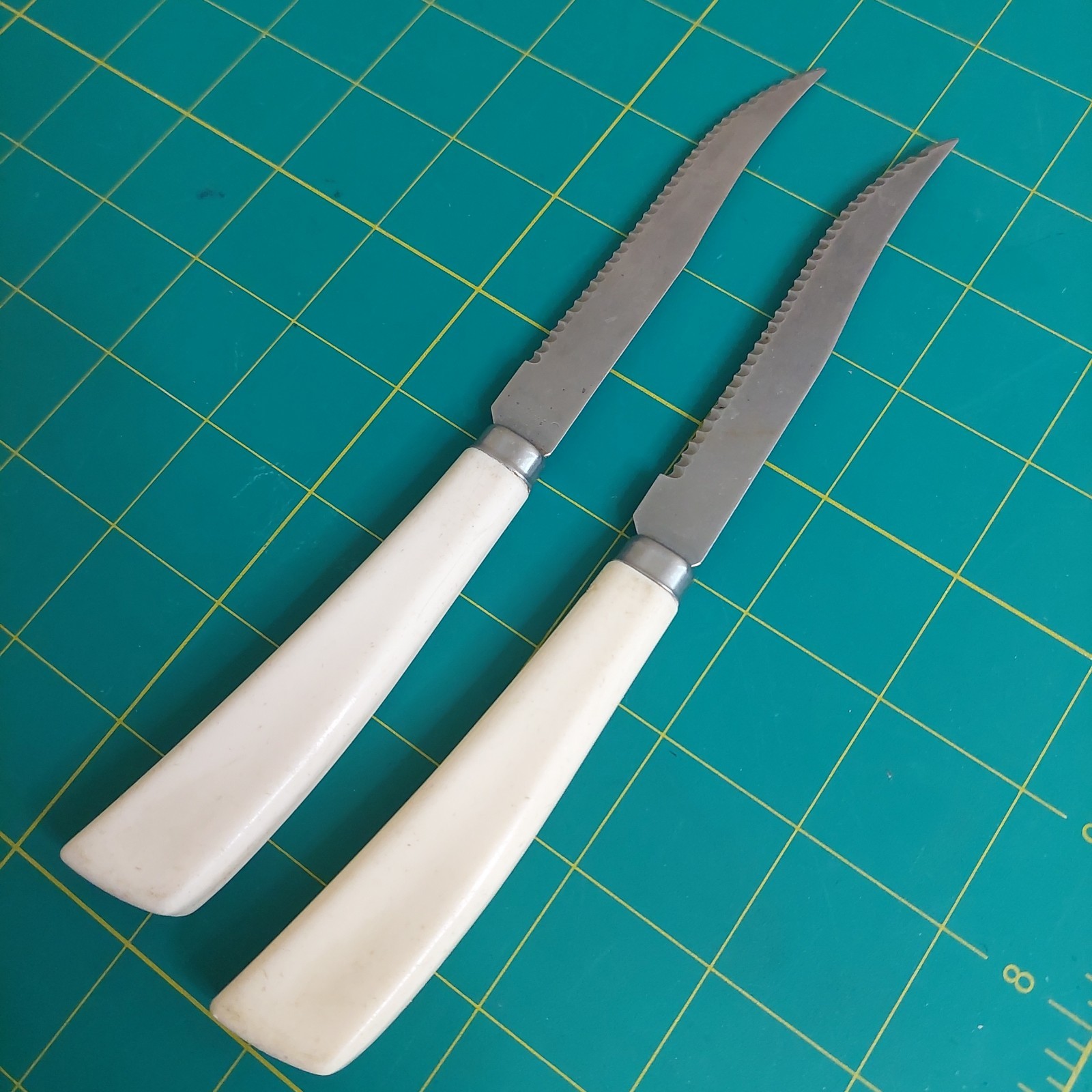 2 Vintage Quikut Stainless Steel Steak Knives Cream Made in the USA